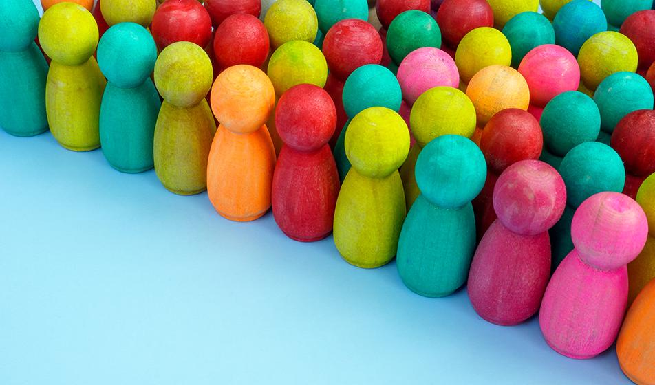 Rows of multicoloured bowling pins are shown lined up. They stand on a pale blue surface. 